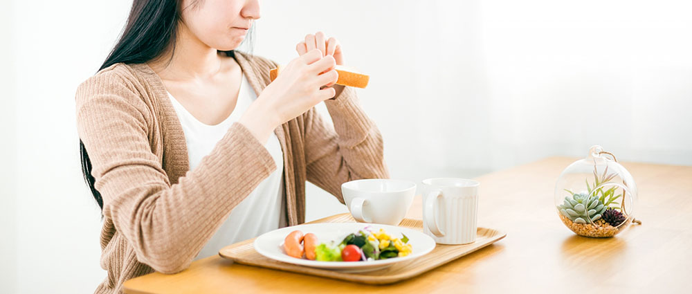 食欲不振の女性